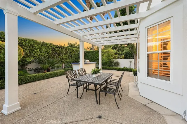 a view of a patio with a table and chairs