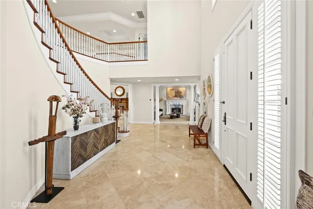 a view of a hallway with wooden floor and windows