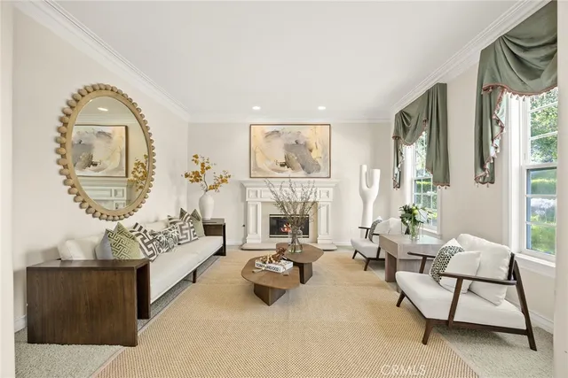 a living room with furniture a fireplace and decor
