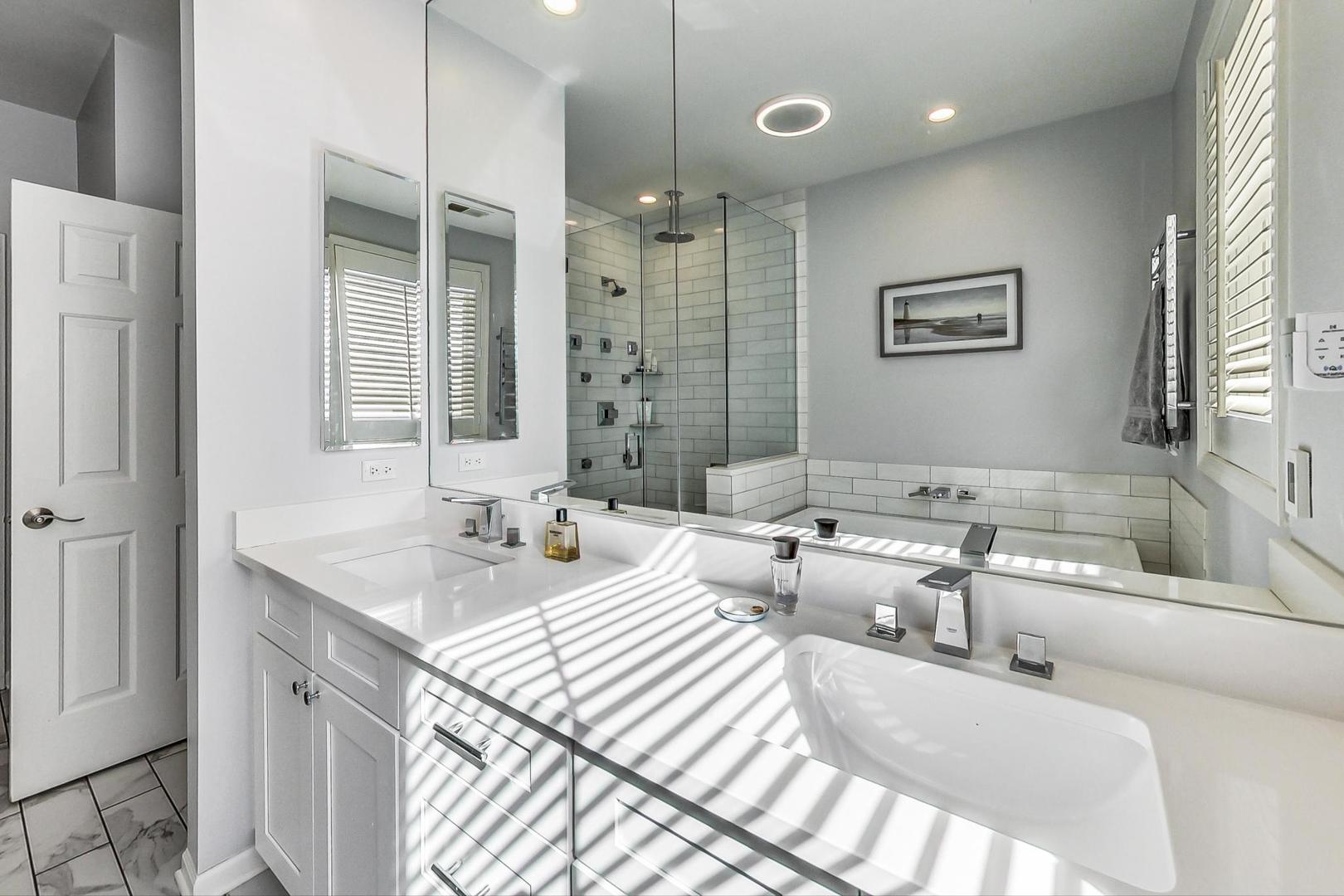 1351 West Altgeld Street, Unit 4D Chicago, IL 60614 - Photo 16 of 30 a spacious bathroom with sinks mirror and a shower