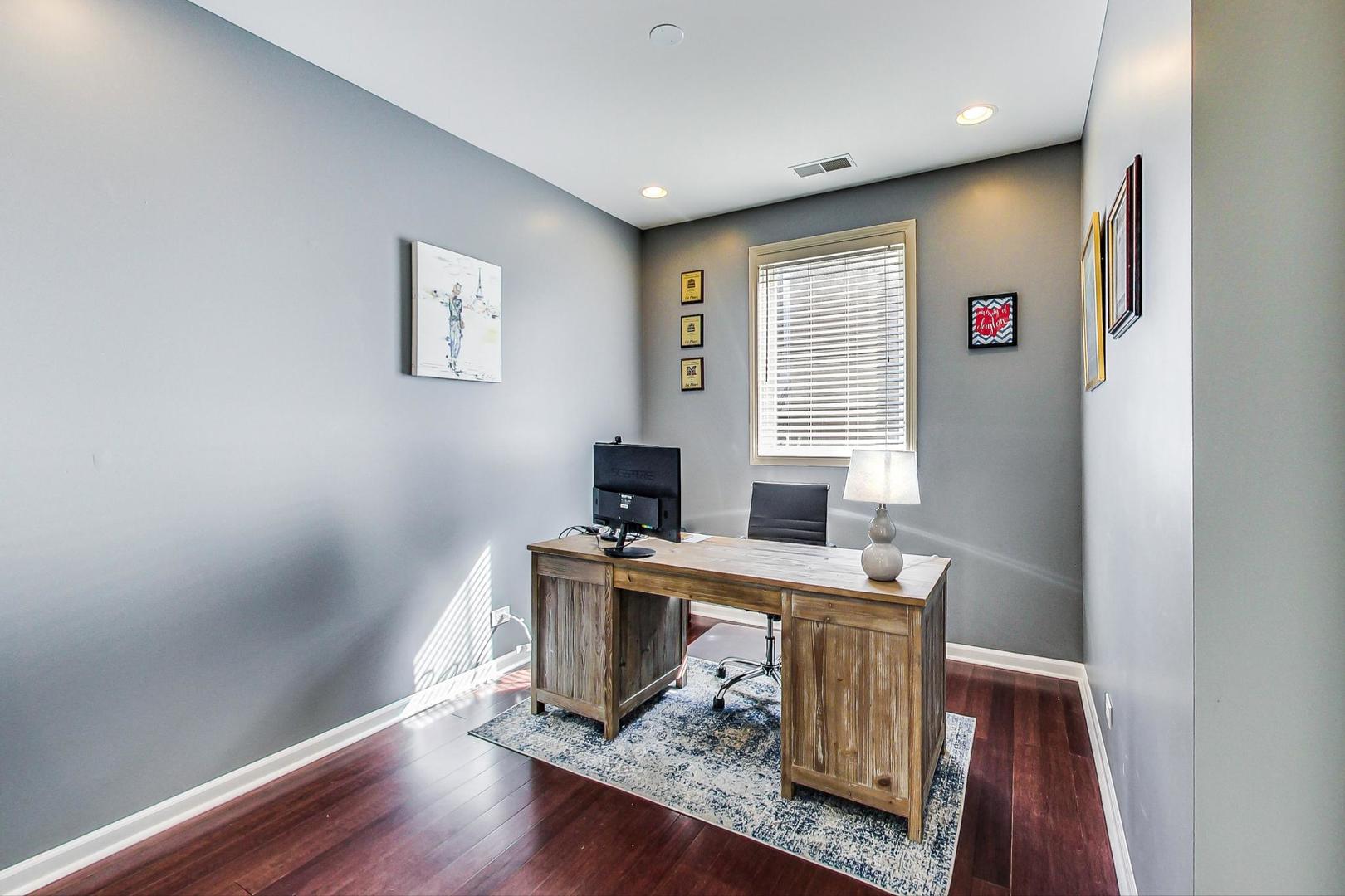 1351 West Altgeld Street, Unit 4D Chicago, IL 60614 - Photo 18 of 30 a view of a workspace with furniture and wooden floor