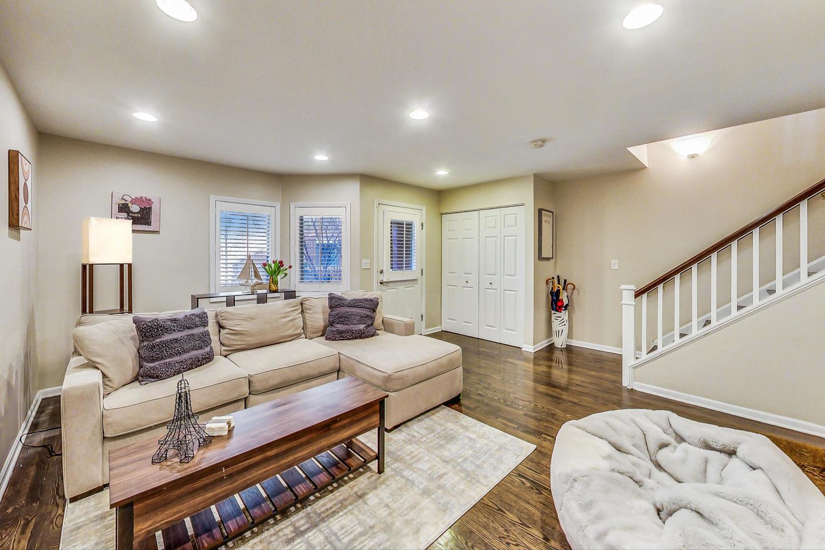 1351 West Altgeld Street, Unit 4D Chicago, IL 60614 - Photo 2 of 30 a living room with furniture and a wooden floor