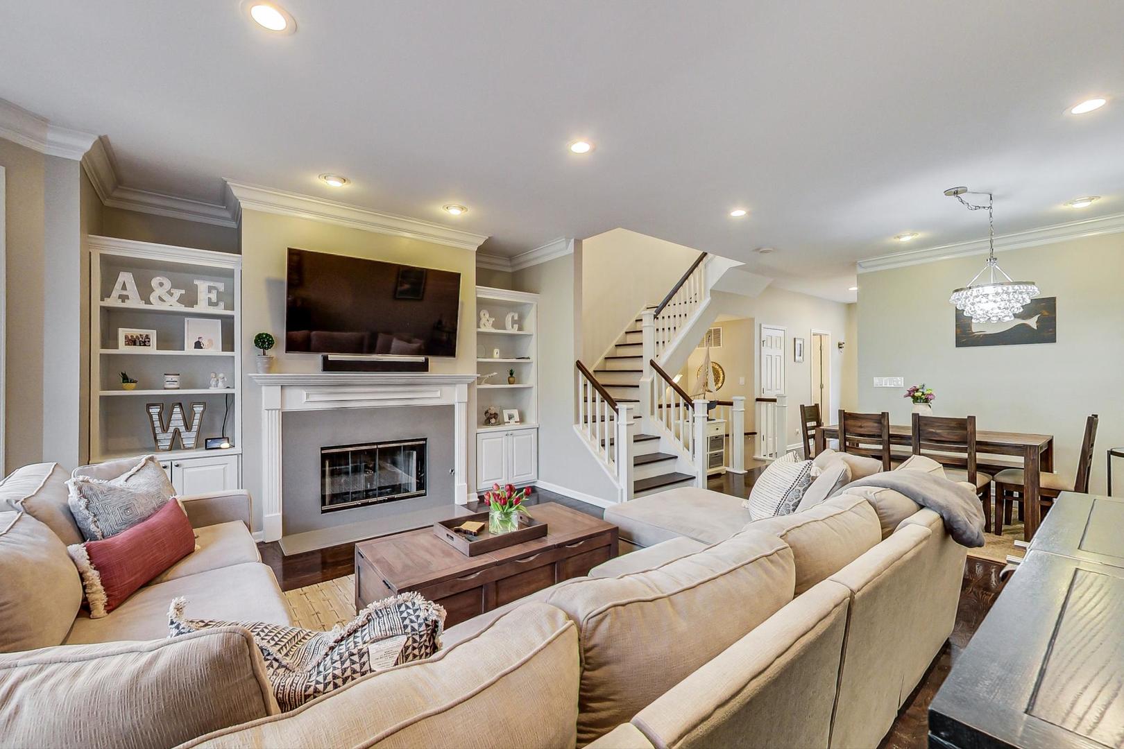 1351 West Altgeld Street, Unit 4D Chicago, IL 60614 - Photo 5 of 30 a living room with furniture a flat screen tv and a fireplace