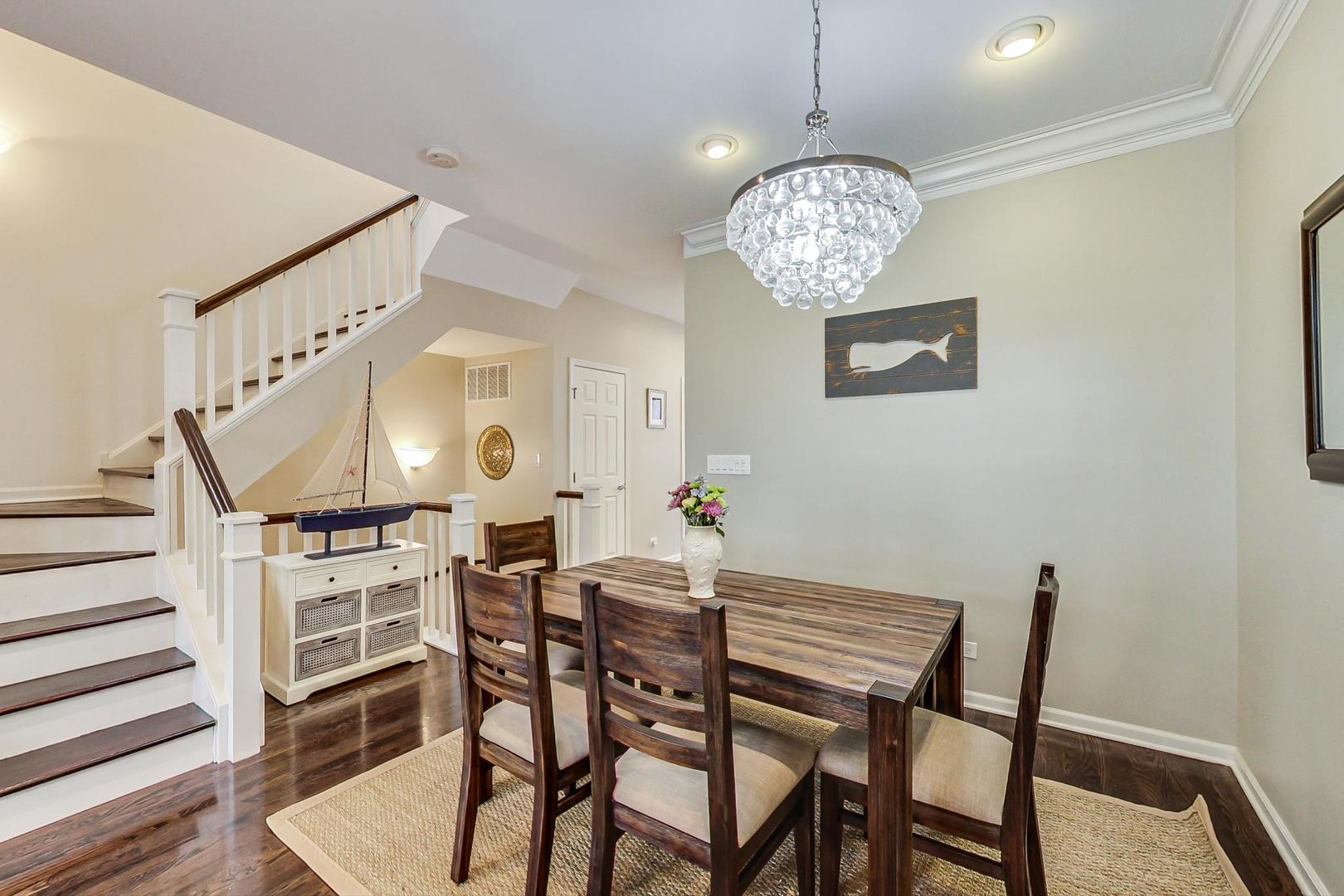 1351 West Altgeld Street, Unit 4D Chicago, IL 60614 - Photo 8 of 30 a view of a dining room with furniture and wooden floor