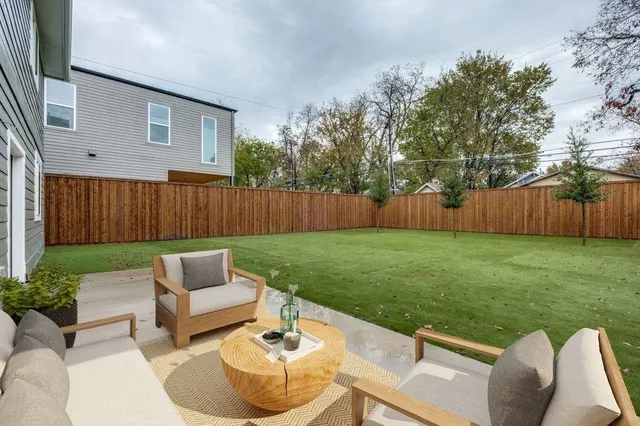 a view of backyard with seating space