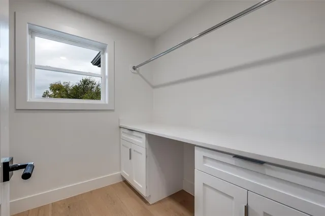 a view of a hallway with closet