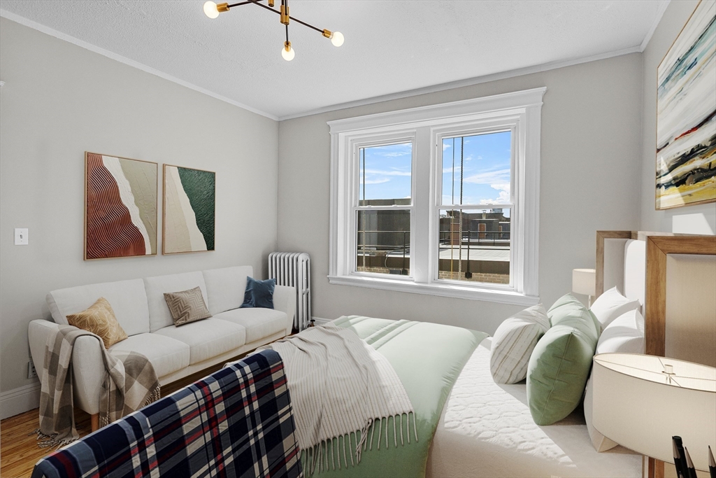 15 Park Drive, Unit 35 Boston, MA 02215 - Photo 2 of 9 a bedroom with a bed and a couch