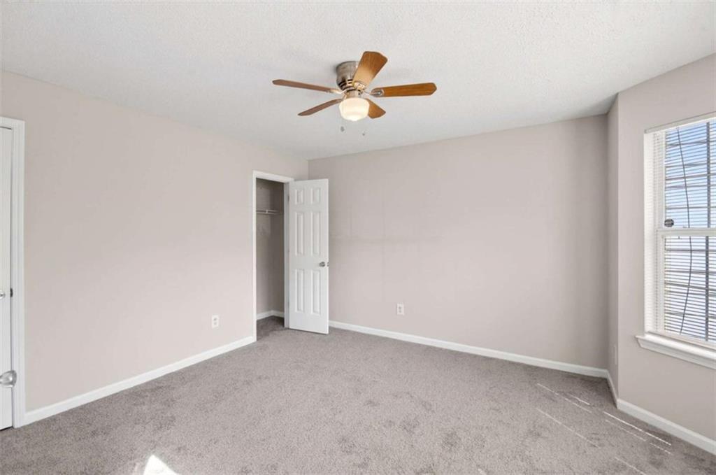 1727 Rice Square Lithonia, GA 30058 - Photo 12 of 33 a view of an empty room with a window
