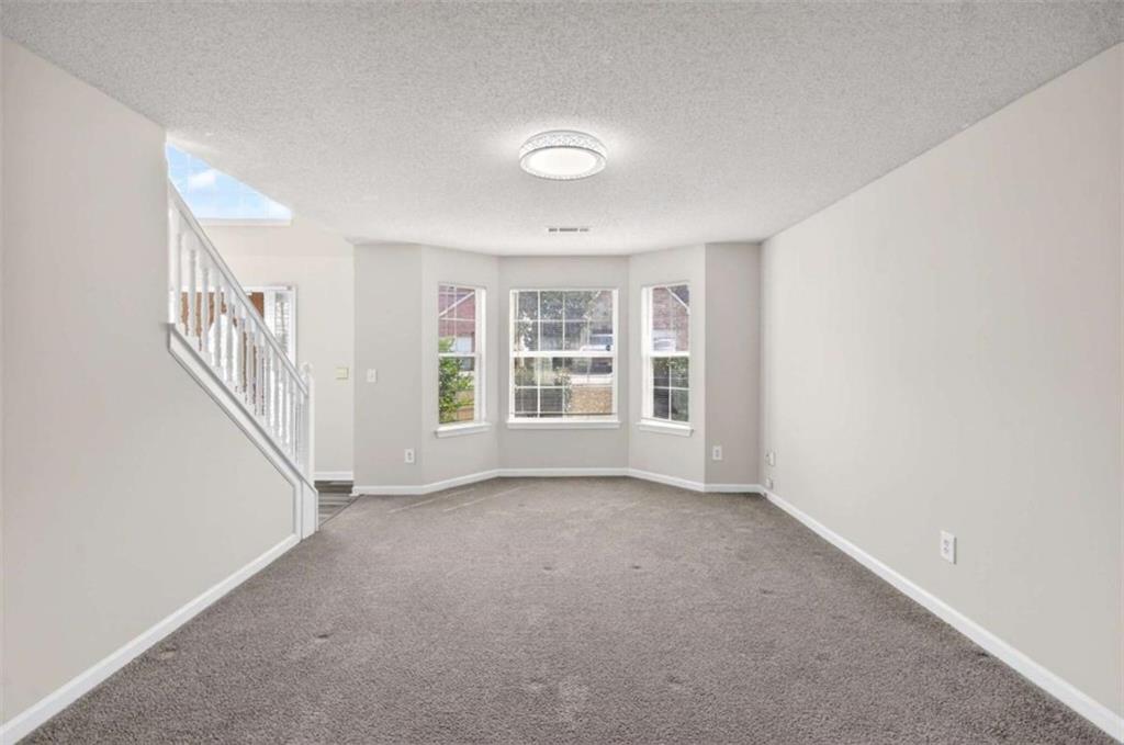 1727 Rice Square Lithonia, GA 30058 - Photo 13 of 33 a view of an empty room with a window