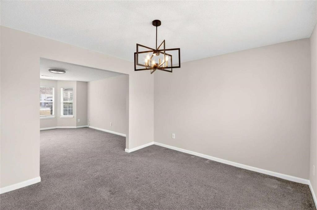 1727 Rice Square Lithonia, GA 30058 - Photo 15 of 33 a view of a room with a hanging light