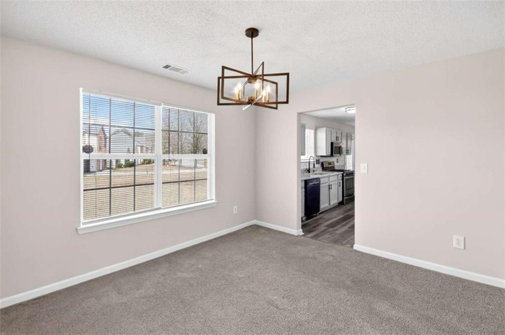 1727 Rice Square Lithonia, GA 30058 - Photo 16 of 33 a view of an empty room with a window