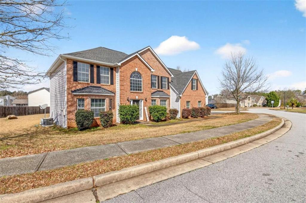 1727 Rice Square Lithonia, GA 30058 - Photo 2 of 33 a view of a white house with a yard