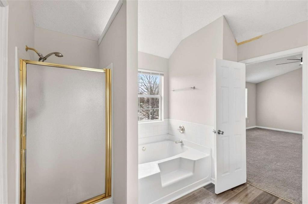 1727 Rice Square Lithonia, GA 30058 - Photo 21 of 33 a bathroom with a bathtub and a shower