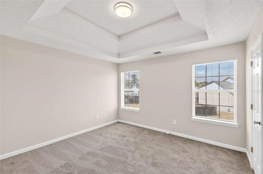 1727 Rice Square Lithonia, GA 30058 - Photo 23 of 33 an empty room with windows