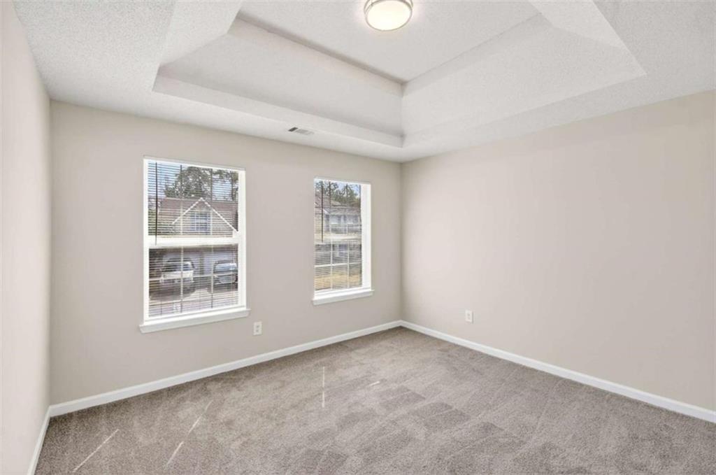 1727 Rice Square Lithonia, GA 30058 - Photo 25 of 33 an empty room with windows