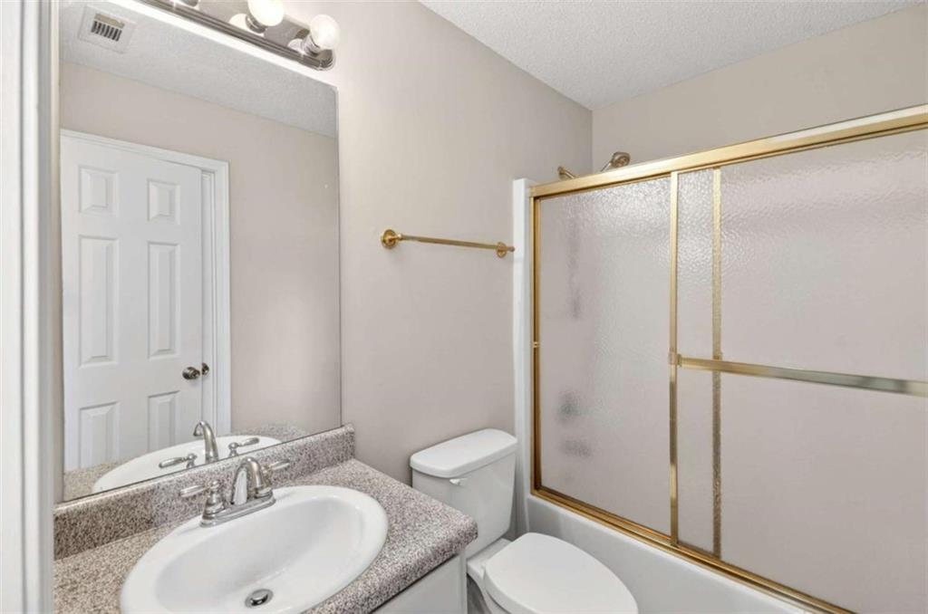 1727 Rice Square Lithonia, GA 30058 - Photo 29 of 33 a bathroom with a sink toilet and shower
