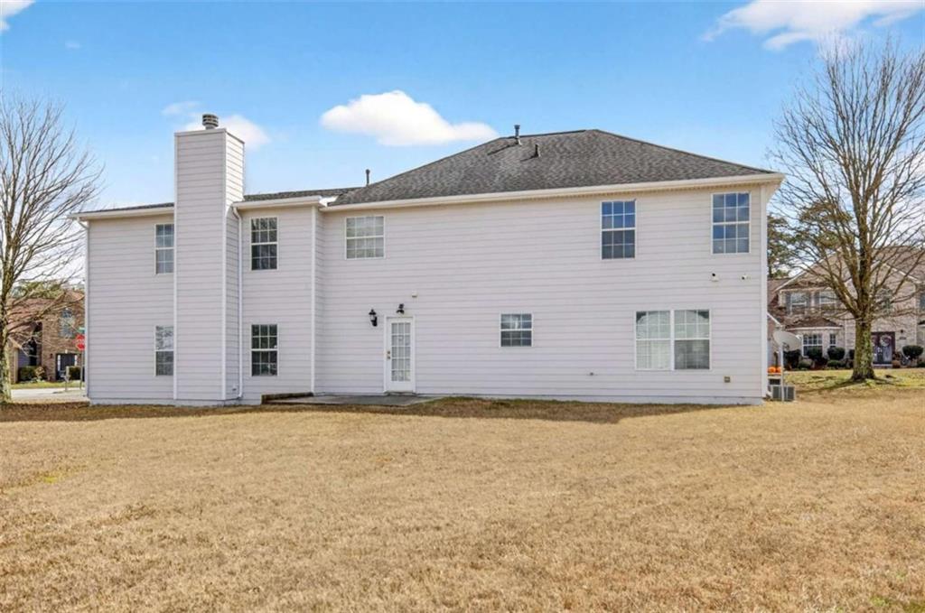 1727 Rice Square Lithonia, GA 30058 - Photo 30 of 33 a view of a house with a yard
