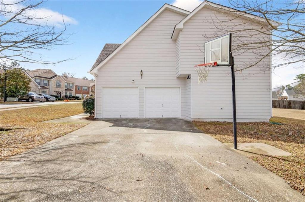 1727 Rice Square Lithonia, GA 30058 - Photo 31 of 33 a view of a parking space in front of a house