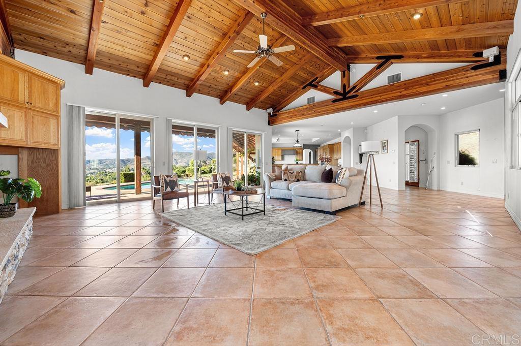 2155 Mil Sorpresas Drive Fallbrook, CA 92028 - Photo 14 of 48 a living room with lots of furniture and a chandelier