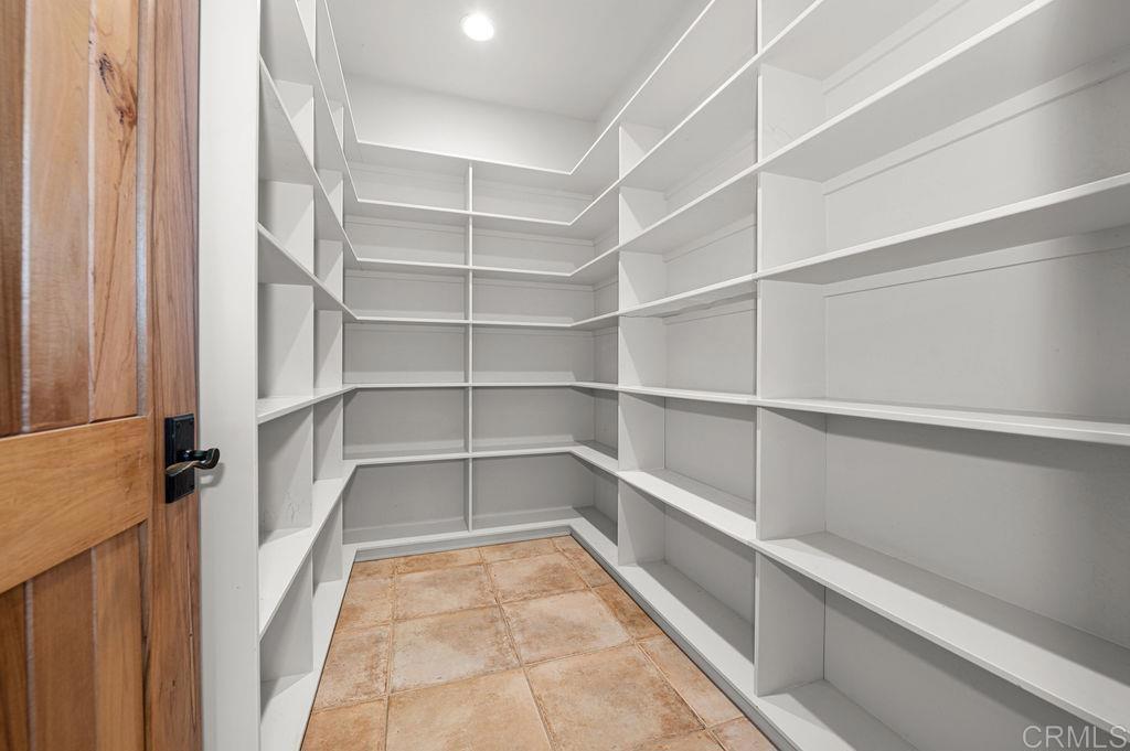 2155 Mil Sorpresas Drive Fallbrook, CA 92028 - Photo 20 of 48 a view of walk in closet with empty racks