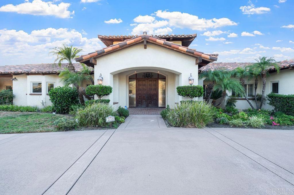 2155 Mil Sorpresas Drive Fallbrook, CA 92028 - Photo 2 of 48 front view of a house with a yard