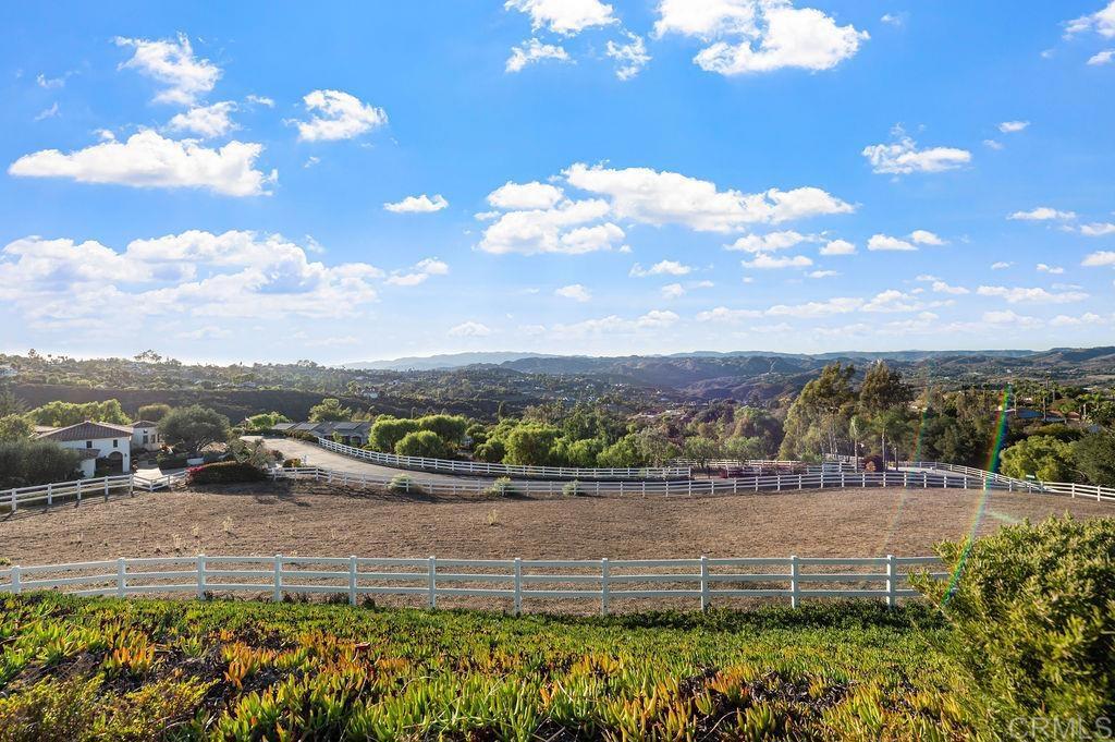 2155 Mil Sorpresas Drive Fallbrook, CA 92028 - Photo 38 of 48 a view of a lake with a mountain