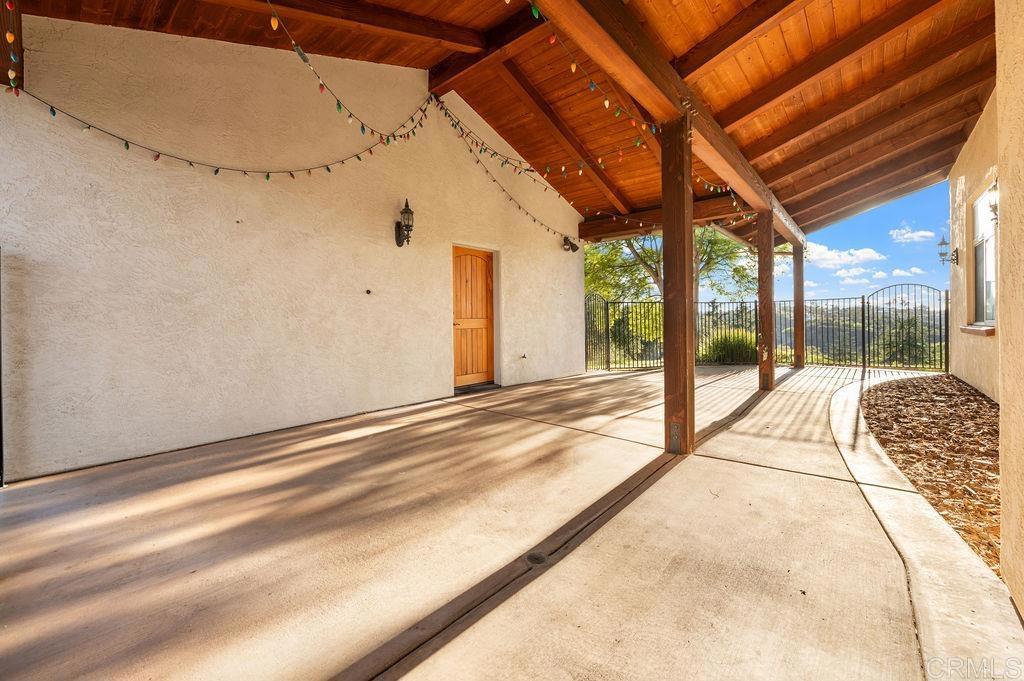 2155 Mil Sorpresas Drive Fallbrook, CA 92028 - Photo 43 of 48 a view of a room with wooden floor and a bed
