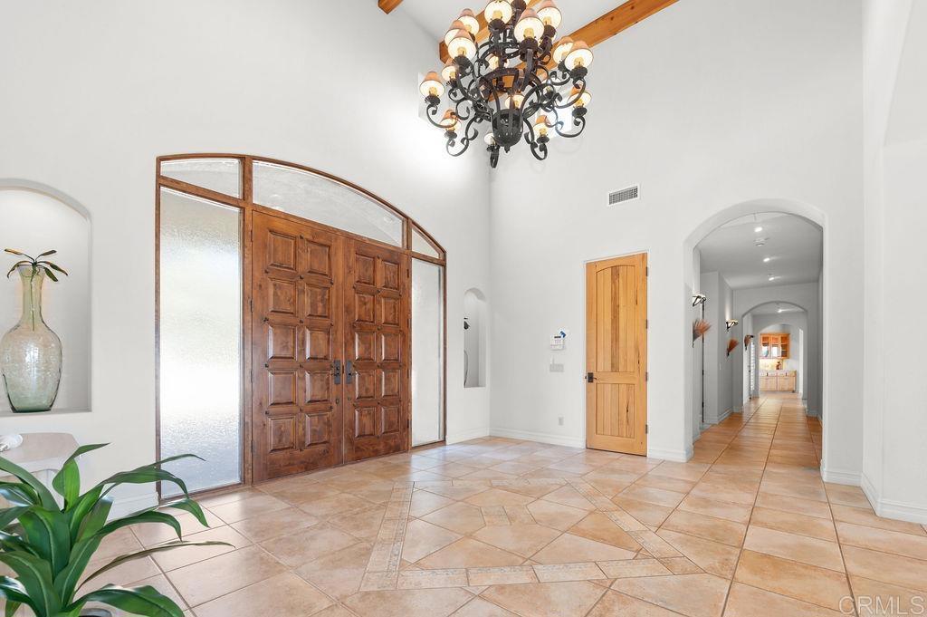 2155 Mil Sorpresas Drive Fallbrook, CA 92028 - Photo 9 of 48 a view of a hallway to a livingroom with furniture