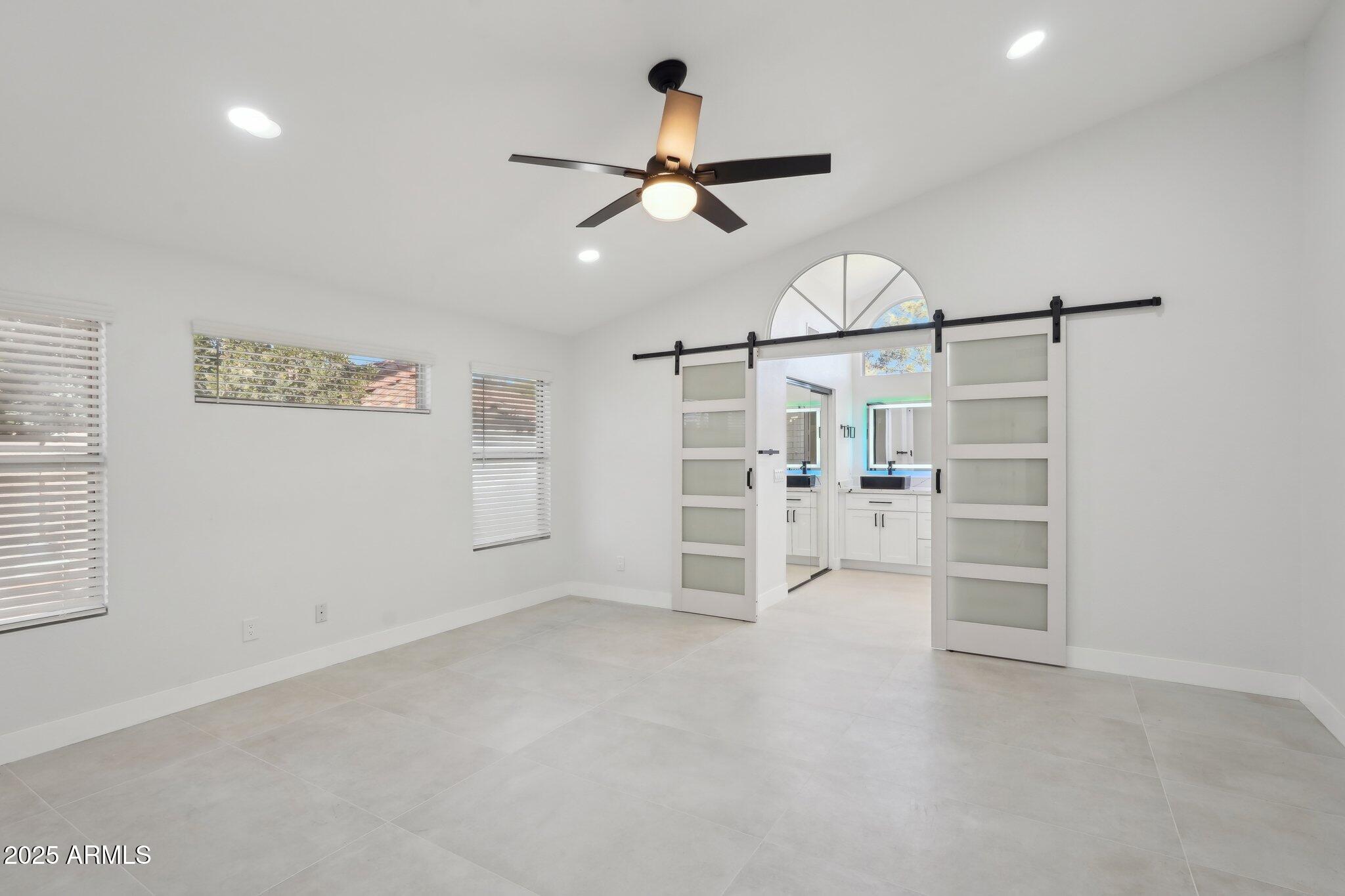 5704 East Estrid Avenue Scottsdale, AZ 85254 - Photo 14 of 48 wooden floor & ceiling fan in a room