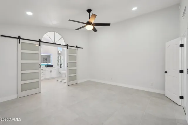 an empty room with shelves and closet