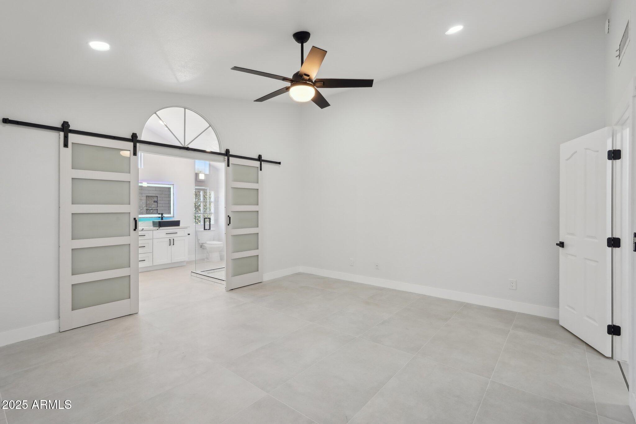 5704 East Estrid Avenue Scottsdale, AZ 85254 - Photo 15 of 48 an empty room with shelves and closet