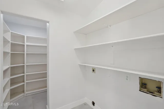 a view of an empty walk in closet