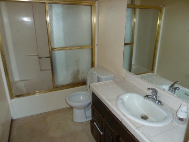 77 Overpass Road, Unit B Watsonville, CA 95076 - Photo 7 of 10 a bathroom with a sink and a mirror