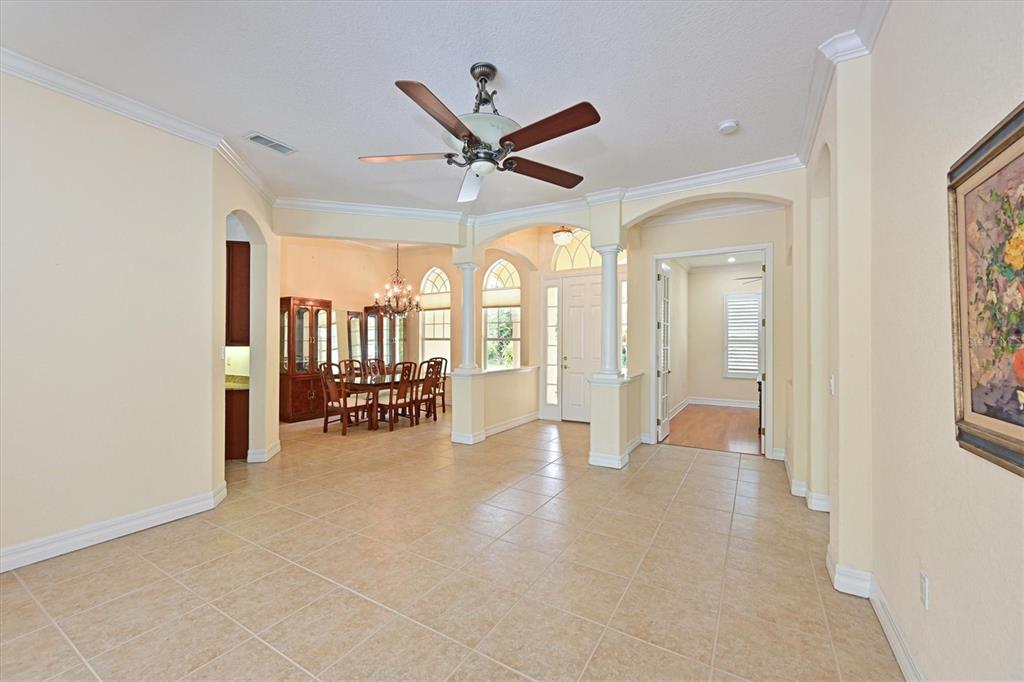 10622 Conch Shell Terrace Bradenton, FL 34212 - Photo 22 of 69 a view of a livingroom with a ceiling fan and window