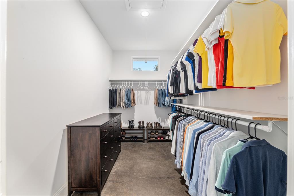 6012 168th Street Alachua, FL 32615 - Photo 29 of 48 a view of walk in closet with clothes and shoes