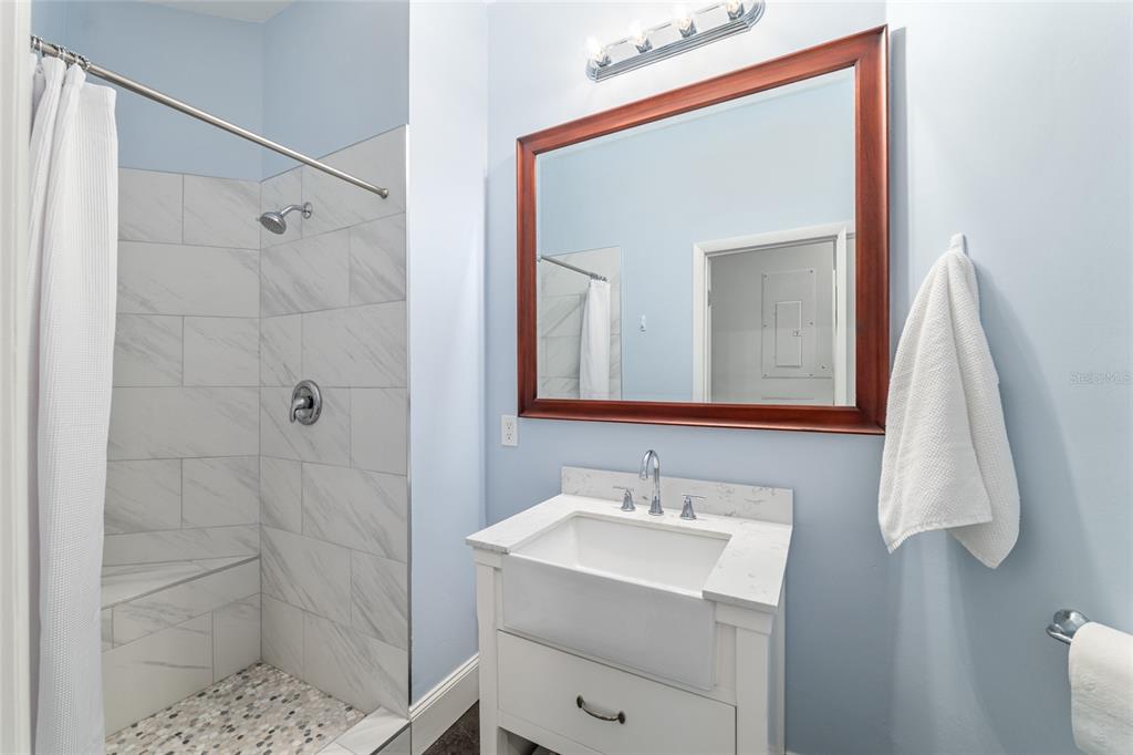 6012 168th Street Alachua, FL 32615 - Photo 34 of 48 a bathroom with a sink vanity and a mirror