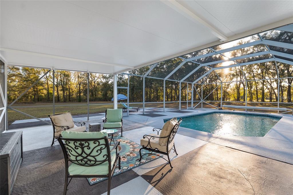 6012 168th Street Alachua, FL 32615 - Photo 39 of 48 a patio with yard table and chairs