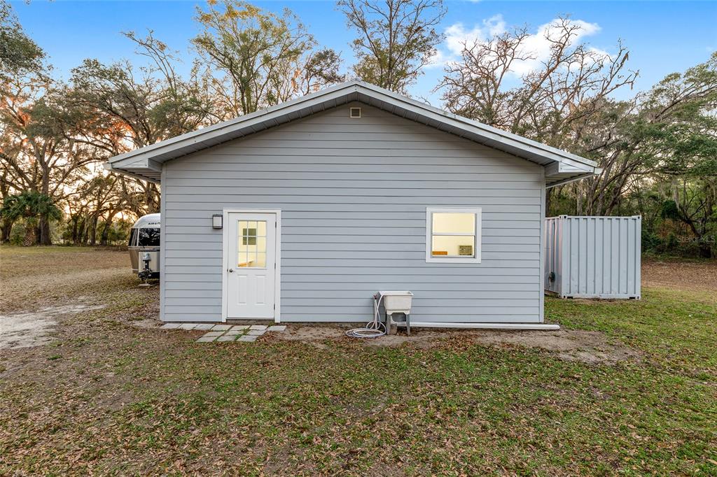6012 168th Street Alachua, FL 32615 - Photo 40 of 48 a view of a house with a yard