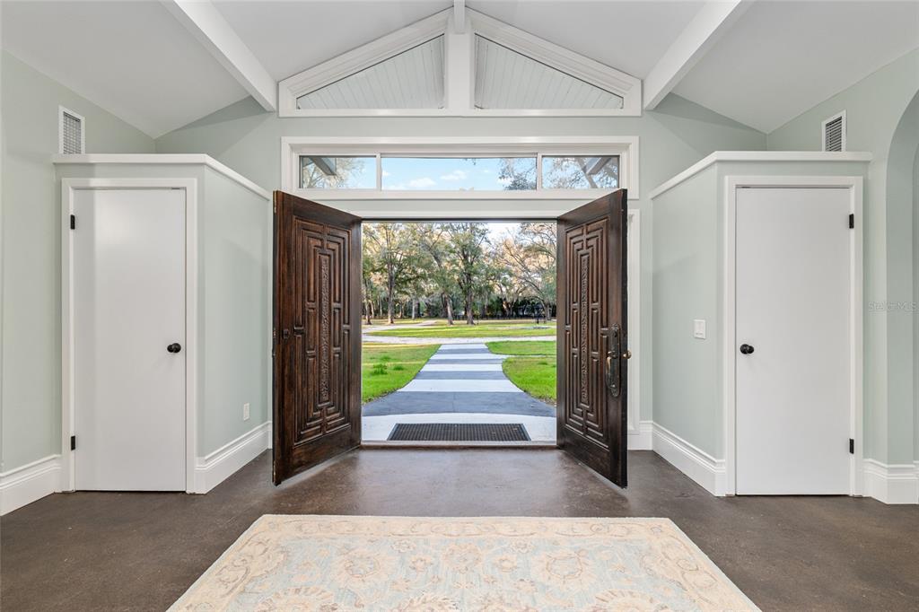 6012 168th Street Alachua, FL 32615 - Photo 8 of 48 a view of a hallway with wooden floor and a fireplace