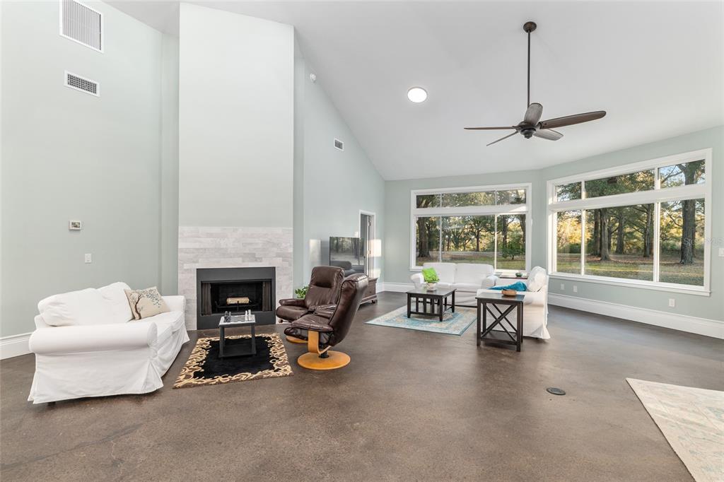 6012 168th Street Alachua, FL 32615 - Photo 9 of 48 a living room with furniture and a fireplace