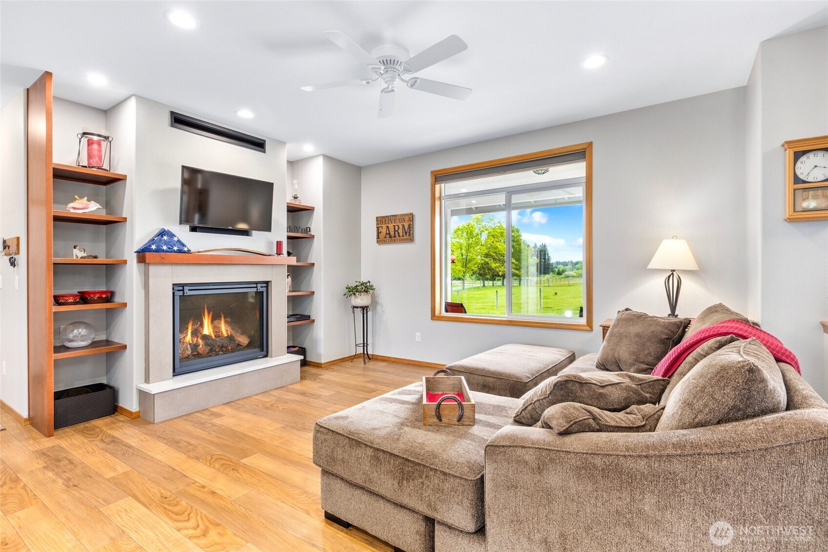 14419 Martinson Road Southeast Yelm, WA 98597 - Photo 9 of 39 a living room with furniture and a fireplace