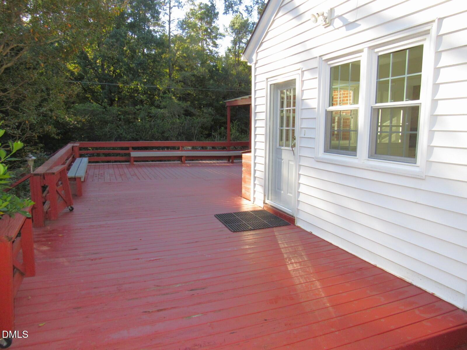 600 North 18th Street Butner, NC 27509 - Photo 44 of 56 a view of backyard with deck and outdoor seating
