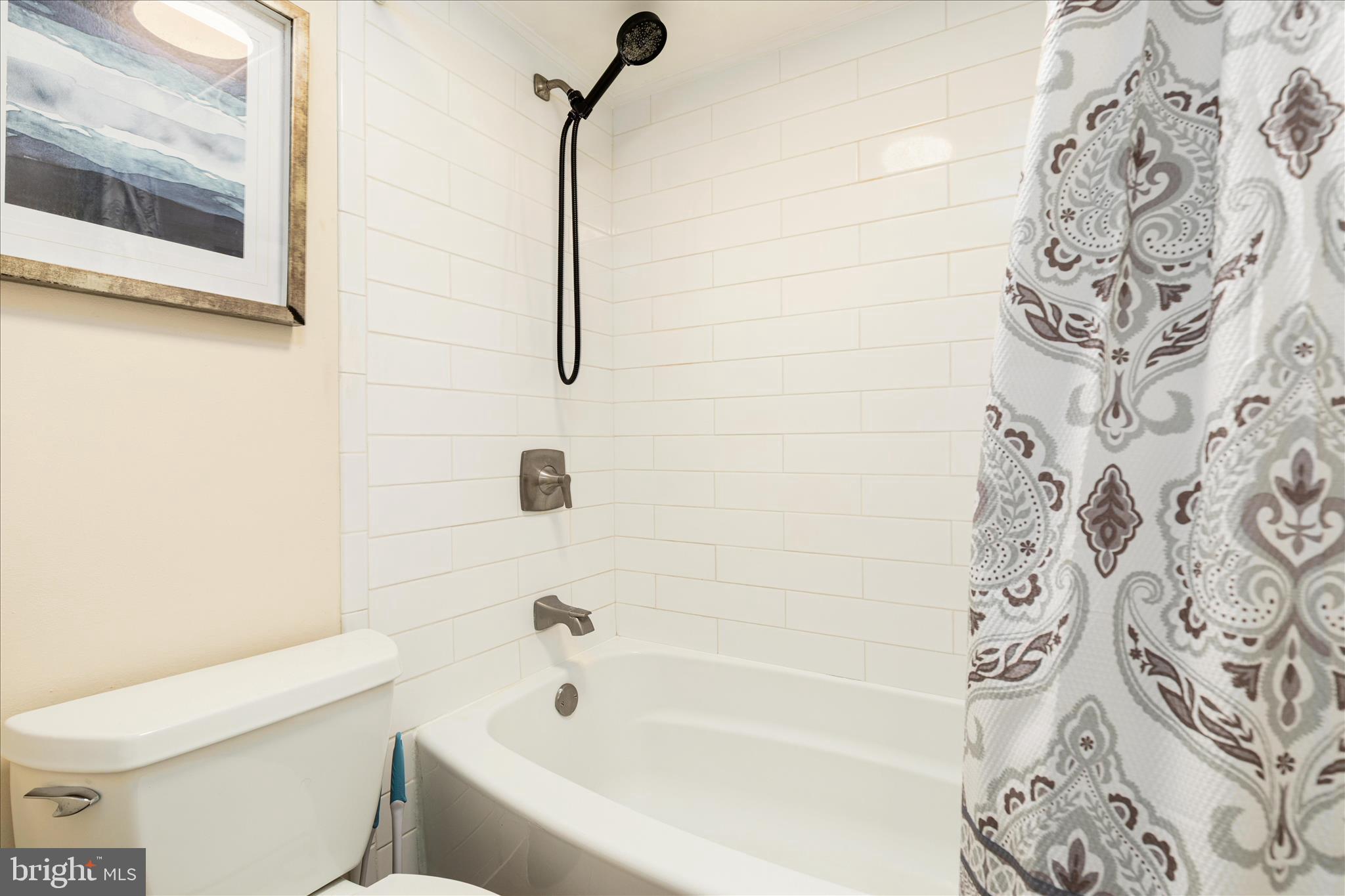 125 Clubhouse Drive Southwest, Unit 1 Leesburg, VA 20175 - Photo 13 of 17 a bathroom with a bathtub and shower