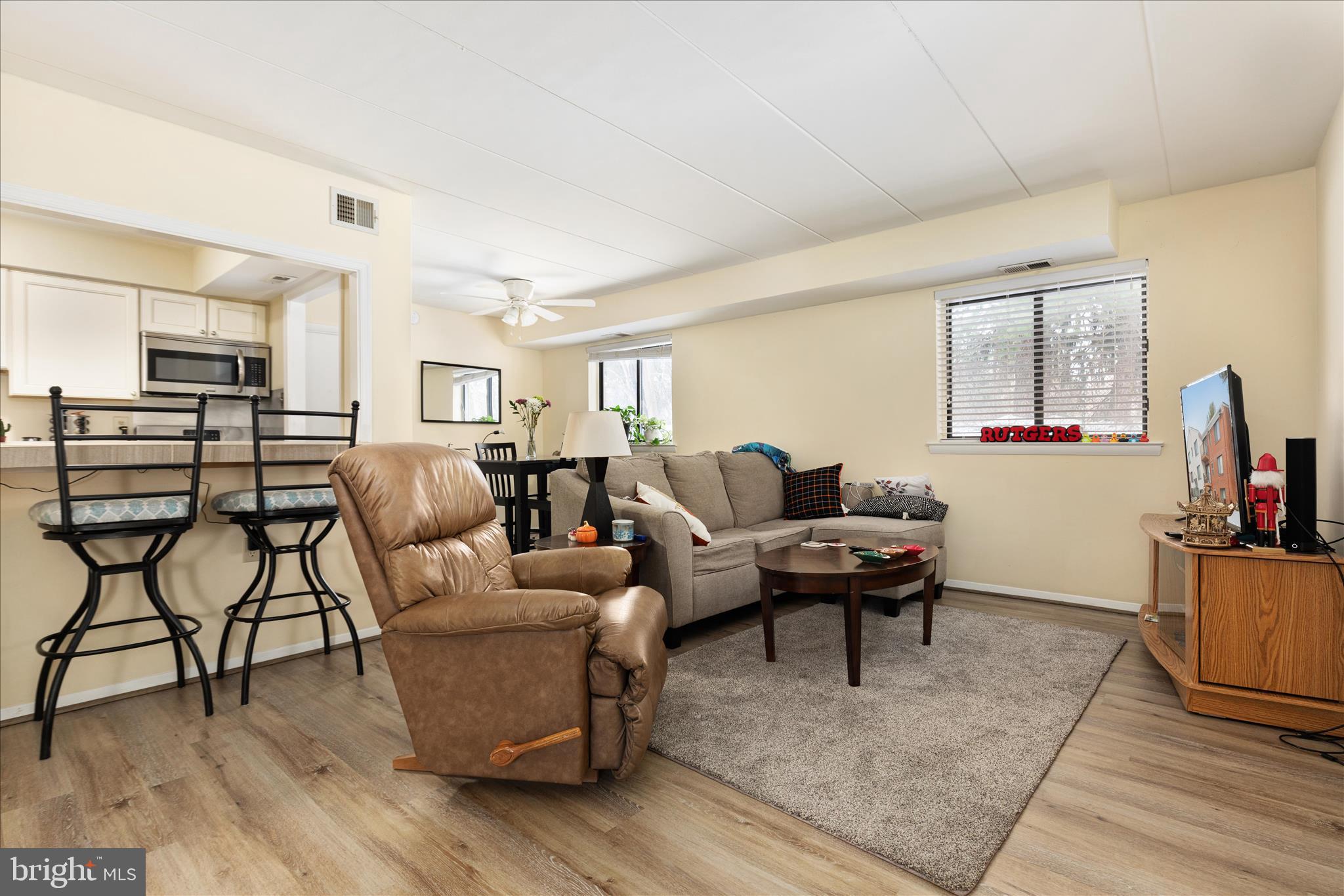 125 Clubhouse Drive Southwest, Unit 1 Leesburg, VA 20175 - Photo 9 of 17 a living room with furniture and wooden floor