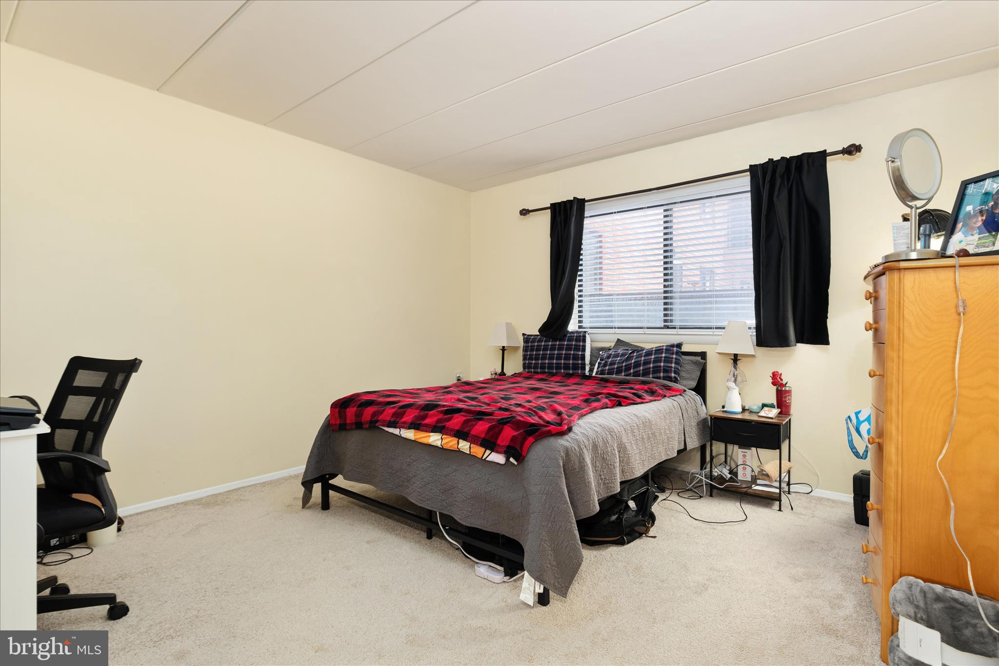 125 Clubhouse Drive Southwest, Unit 1 Leesburg, VA 20175 - Photo 10 of 17 a bed room with a bed and a window