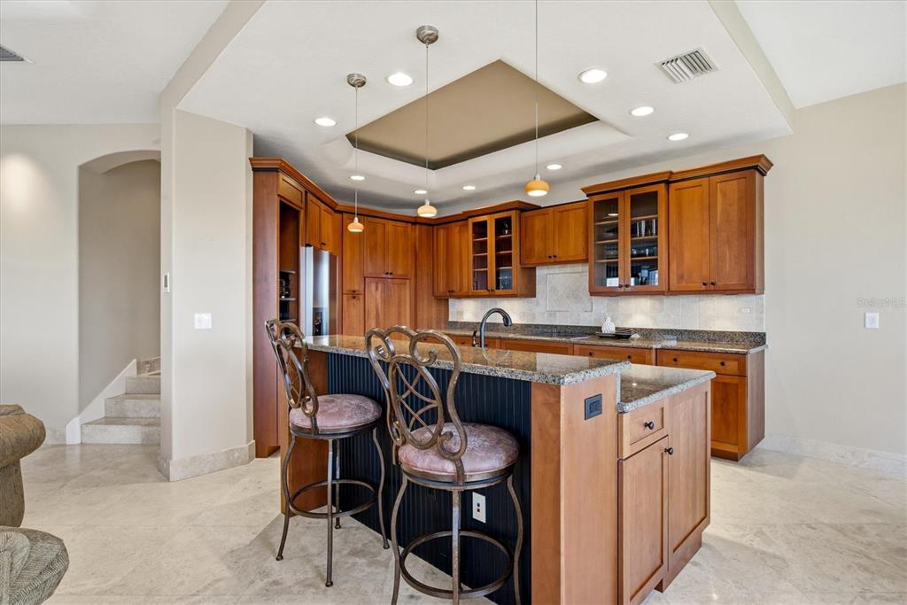 761 Norton Street Longboat Key, FL 34228 - Photo 39 of 66 a kitchen with stainless steel appliances granite countertop a stove and a refrigerator