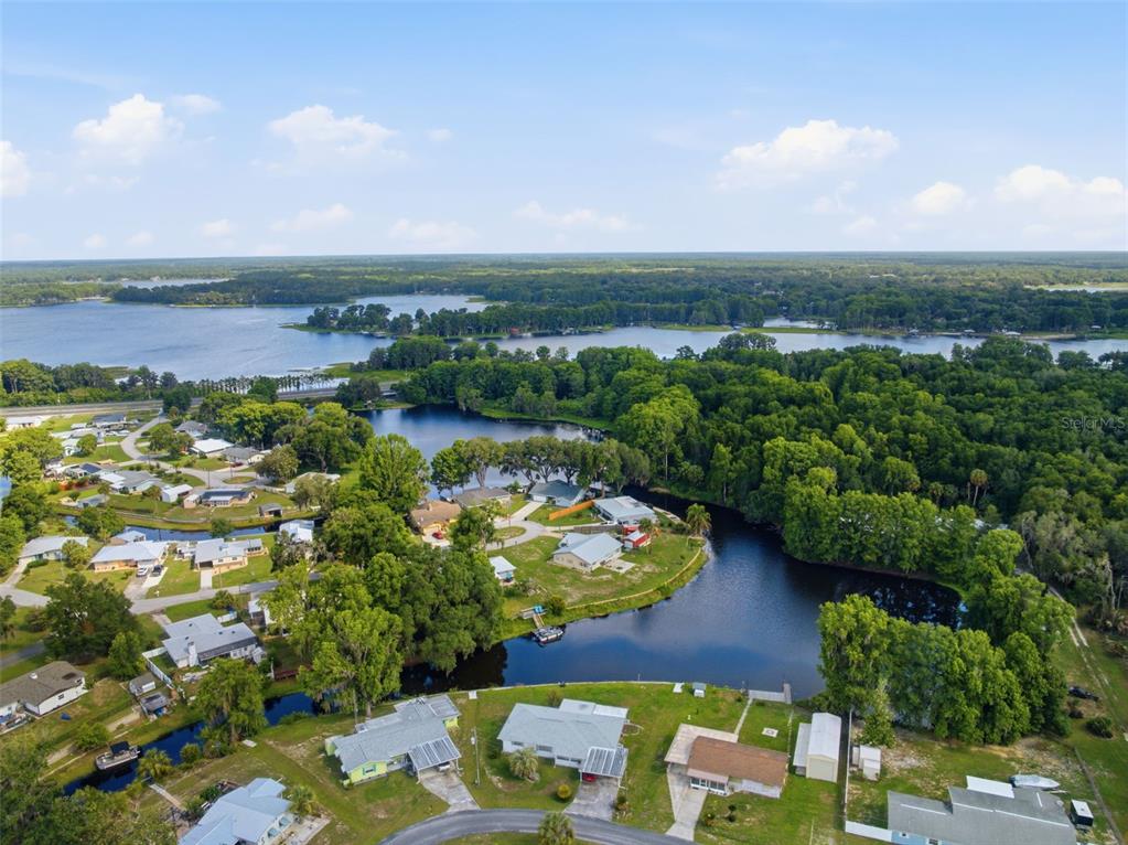 1830 South Mandarin Terrace Inverness, FL 34450 - Photo 28 of 47 an aerial view of lake and residential houses with outdoor space