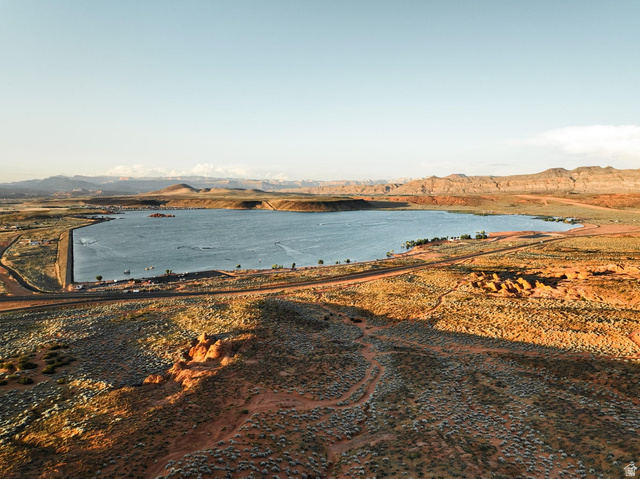 1693 Devils Gdn Lane Washington, UT 84780 - Photo 56 of 64 Expansive desert landscape featuring a large body of water, distant mountain ranges, and rugged terrain