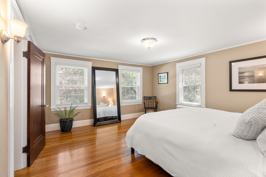 513 Chestnut Street Newton, MA 02468 - Photo 11 of 32 a spacious bedroom with a large bed and a large window