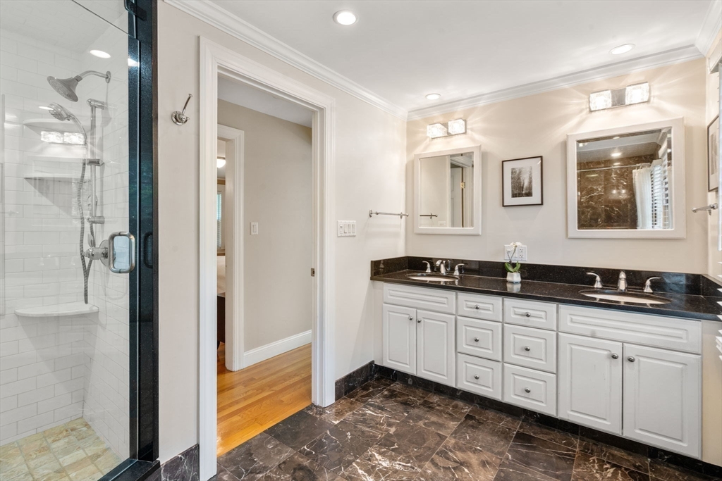 513 Chestnut Street Newton, MA 02468 - Photo 12 of 32 a bathroom with double sink and a mirror